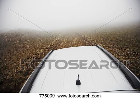 Stock Photo - Foggy road in Landmannalaugar, Iceland. Fotosearch
