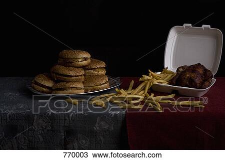 Hamburgers, French fries and roasted chicken, still life View Large Photo Image Stock Image - Hamburgers, French fries and roasted chicken, still life. Fotosearch