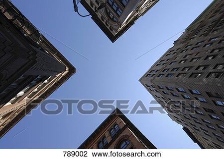 Low angle view of city buildings, Manhattan, New York City, USA View Large Photo Image Stock Image - Low angle view of city buildings, Manhattan, New York City, USA. Fotosearch
