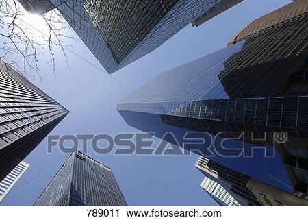 Low angle view of skyscrapers, Manhattan, New York City, USA View Large Photo Image Stock Image - Low angle view of skyscrapers, Manhattan, New York City, USA. Fotosearch