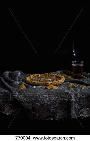 Pizza, potato chips and beer, still life View Large Photo Image Picture - Pizza, potato chips and beer, still life. Fotosearch