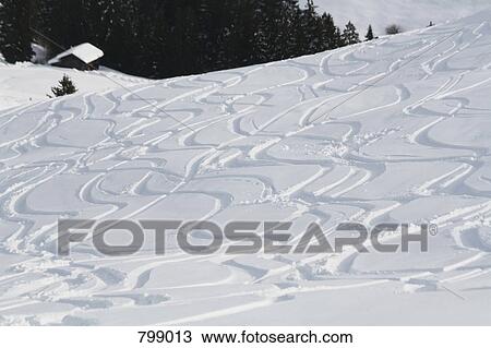 Ski tracks on mountain slope, Graubuenden, Switzerland View Large Photo Image Stock Image - Ski tracks on mountain slope, Graubuenden, Switzerland. Fotosearch