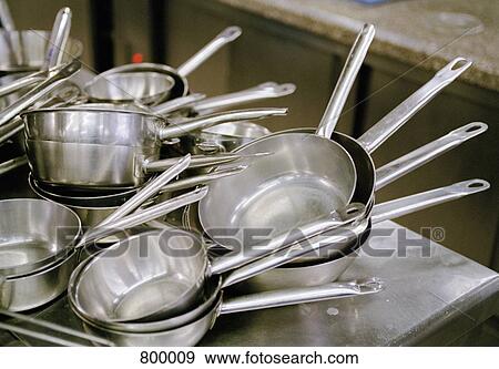 Stacks of saucepans on a bench View Large Photo Image Stock Photo - Stacks of saucepans on a bench. Fotosearch