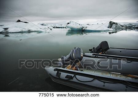 Two outboard motorboats on a glacial lagoon View Large Photo Image Stock Photography - Two outboard motorboats on a glacial lagoon. Fotosearch