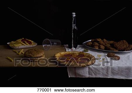 Variety of fast food and beer bottle, still life View Large Photo Image Stock Image - Variety of fast food and beer bottle, still life. Fotosearch