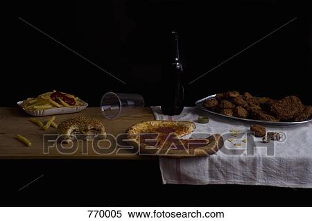 Variety of fast food and beer bottle, still life View Large Photo Image Stock Photography - Variety of fast food and beer bottle, still life. Fotosearch