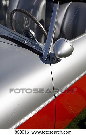 Stock Photography - A close-up detail of a retro sports car. Fotosearch