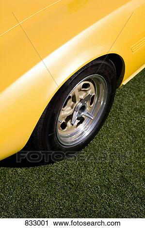 A close-up detail of a yellow sports car View Large Photo Image Stock Image - A close-up detail of a yellow sports car. Fotosearch