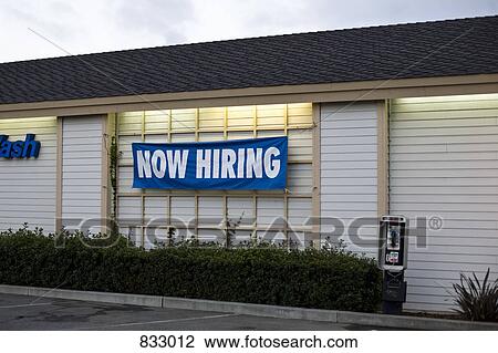 Stock Image - A NOW HIRING sign. Fotosearch