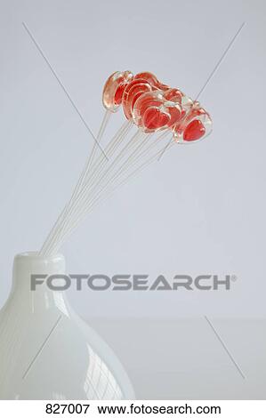 Heart shape lollipops in a vase View Large Photo Image Stock Photo - Heart shape lollipops in a vase. Fotosearch