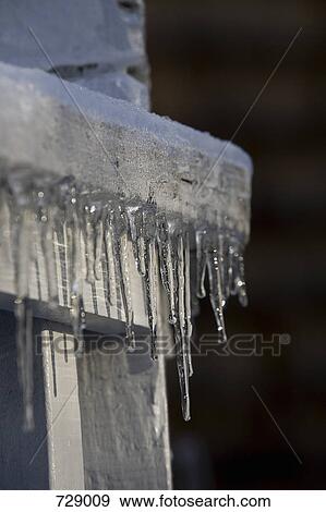 Stock Photo - Icicles on a park bench. Fotosearch