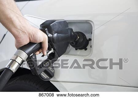 A man's hand pumping gas, close-up View Large Photo Image Stock Photo - A man's hand pumping gas, close-up. Fotosearch