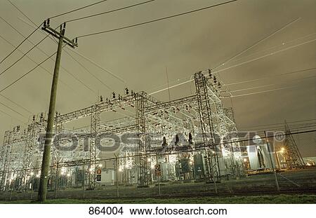 Picture - An electricity power plant at night. Fotosearch