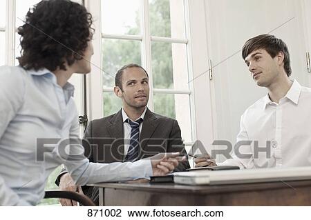 Business colleagues in a meeting View Large Photo Image Stock Image - Business colleagues in a meeting. Fotosearch