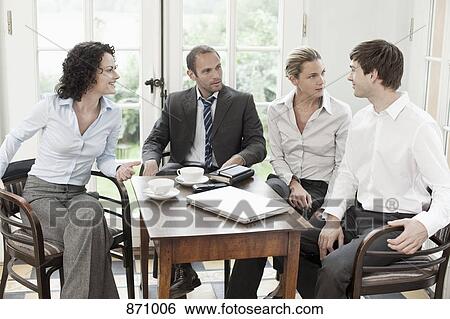 Business colleagues in a meeting View Large Photo Image Stock Photograph - Business colleagues in a meeting. Fotosearch