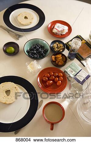 High angle view of food items and drinks arranged on a table View Large Photo Image Picture - High angle view of food items and drinks arranged on a table. Fotosearch