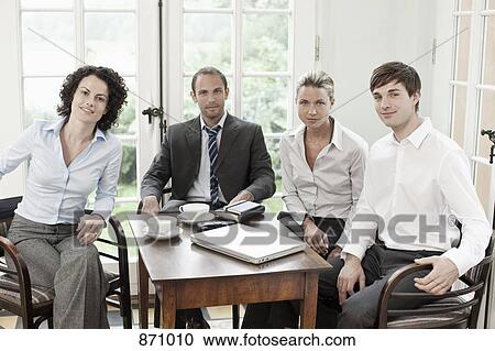 Portrait of business colleagues in a meeting View Large Photo Image Stock Image - Portrait of business colleagues in a meeting. Fotosearch