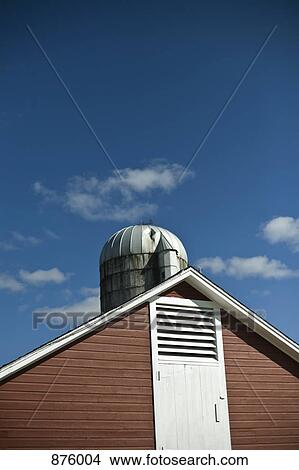 Picture - Roof of a farm building and silo. Fotosearch