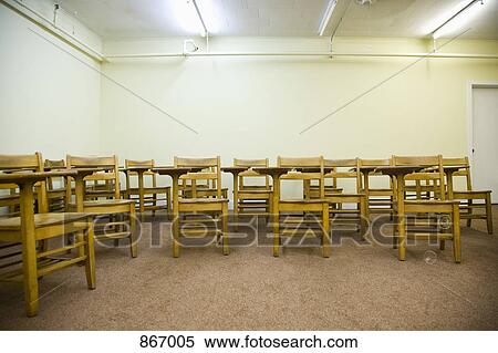 School desks in an empty classroom View Large Photo Image Stock Photography - School desks in an empty classroom. Fotosearch