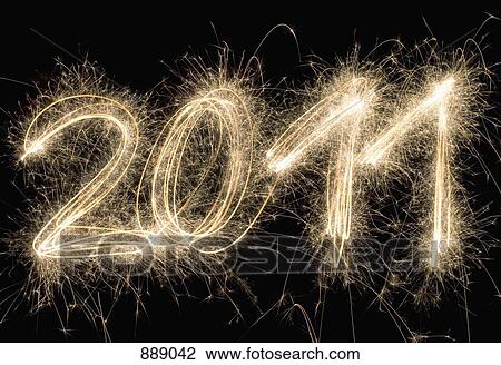 Stock Image - 2011 written with a sparkler. Fotosearch