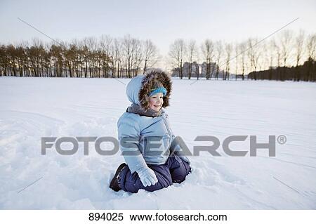 A boy playing in the snow View Large Photo Image Stock Photography - A boy playing in the snow. Fotosearch
