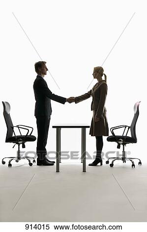 A businessman and businesswoman shaking hands View Large Photo Image Stock Photography - A businessman and businesswoman shaking hands. Fotosearch