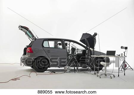 Stock Photography - A car being used in a photo shoot. Fotosearch