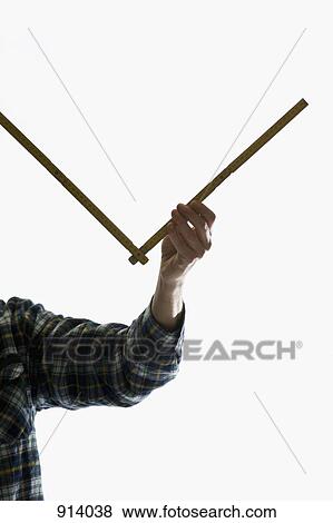 A carpenter using a folding ruler View Large Photo Image Stock Photo - A carpenter using a folding ruler. Fotosearch