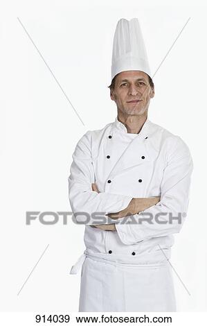 A chef standing with arms crossed, portrait View Large Photo Image Stock Photo - A chef standing with arms crossed, portrait. Fotosearch