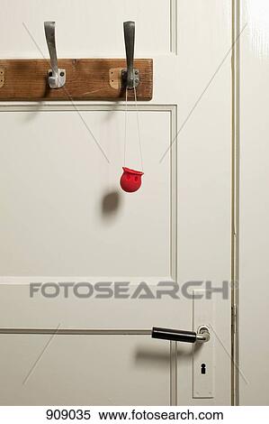 A clown's nose hanging on a coat hook View Large Photo Image Stock Photography - A clown's nose hanging on a coat hook . Fotosearch
