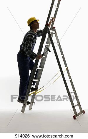 A construction worker climbing a ladder View Large Photo Image Stock Photograph - A construction worker climbing a ladder. Fotosearch
