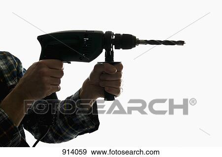 A construction worker using a drill View Large Photo Image Stock Photo - A construction worker using a drill. Fotosearch