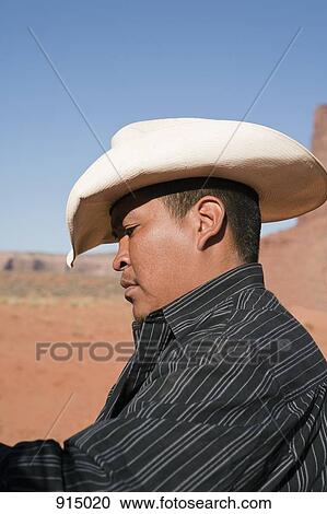 Stock Image - A cowboy, Monument Valley Navajo Tribal Park, Monument Valley, Utah, USA. Fotosearch