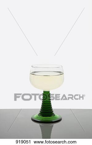 A glass of white wine View Large Photo Image Stock Image - A glass of white wine. Fotosearch