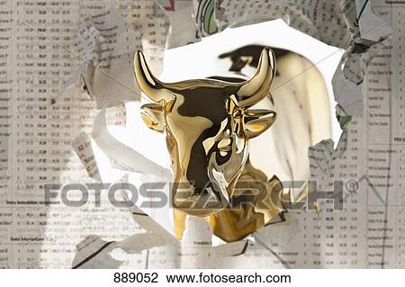 A golden bull breaking through the finance section of a newspaper View Large Photo Image Stock Image - A golden bull breaking through the finance section of a newspaper. Fotosearch