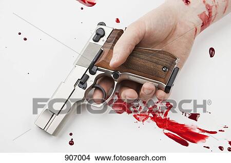 A Hand Holding A Gun Splattered With Blood View Large Photo Image Picture - A Hand Holding A Gun Splattered With Blood. Fotosearch