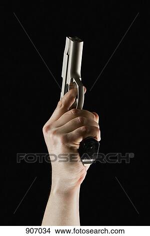 A Hand Pointing A Hand Gun Into The Air View Large Photo Image Picture - A Hand Pointing A Hand Gun Into The Air. Fotosearch