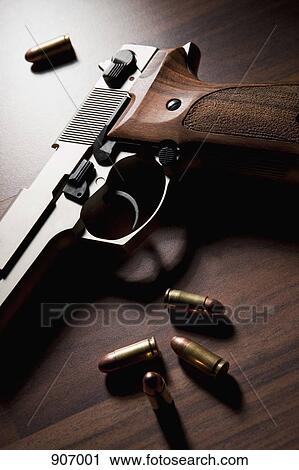 A Handgun With Bullets View Large Photo Image Stock Image - A Handgun With Bullets. Fotosearch