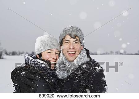 A heterosexual couple embracing, outdoors, portrait View Large Photo Image Stock Image - A heterosexual couple embracing, outdoors, portrait. Fotosearch