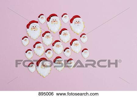 A large group of Santa head decorations in various sizes View Large Photo Image Stock Photograph - A large group of Santa head decorations in various sizes. Fotosearch