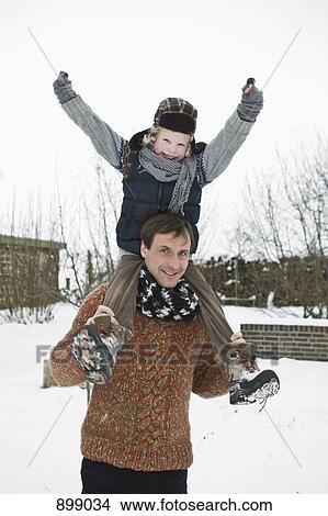 A man carrying his son on his shoulders View Large Photo Image Picture - A man carrying his son on his shoulders. Fotosearch