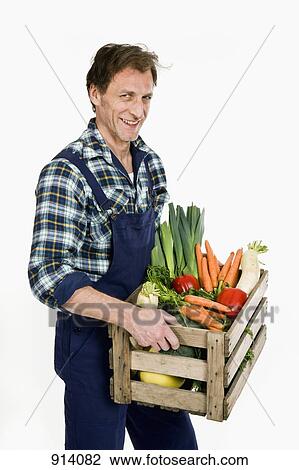 A man delivering organic groceries View Large Photo Image Stock Image - A man delivering organic groceries. Fotosearch