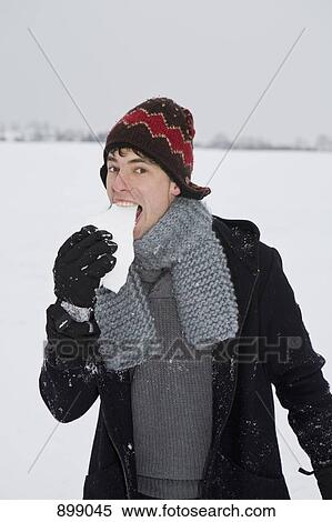 A man eating snow View Large Photo Image Stock Photography - A man eating snow. Fotosearch