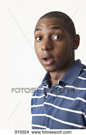 A man looking surprised, studio shot View Large Photo Image Picture - A man looking surprised, studio shot. Fotosearch