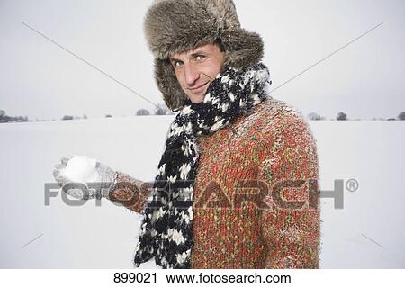 A man preparing to throw a snowball View Large Photo Image Stock Image - A man preparing to throw a snowball. Fotosearch