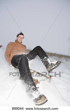 A man sledding View Large Photo Image Picture - A man sledding. Fotosearch
