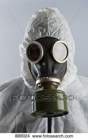Picture - A man wearing a gas mask and protective suit. Fotosearch