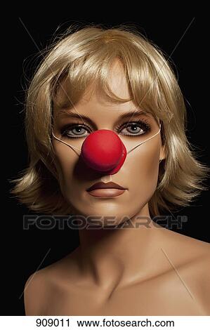 A mannequin wearing a blond wig and a clown's nose View Large Photo Image Stock Image - A mannequin wearing a blond wig and a clown's nose. Fotosearch
