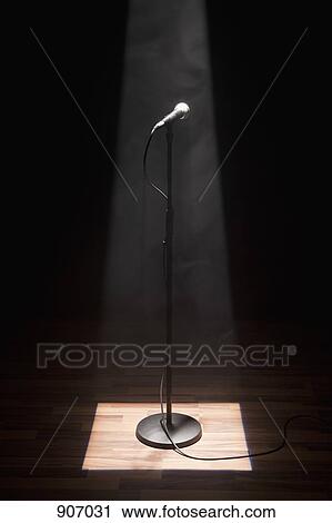 A Microphone On A Stage Illuminated By Spotlight View Large Photo Image Stock Image - A Microphone On A Stage Illuminated By Spotlight. Fotosearch