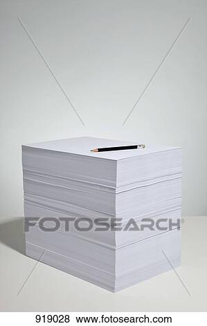 Stock Photo - A pencil on a stack of paper. Fotosearch